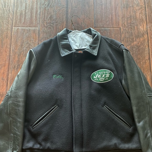 Black varsity jacket XL used with some wear to it.